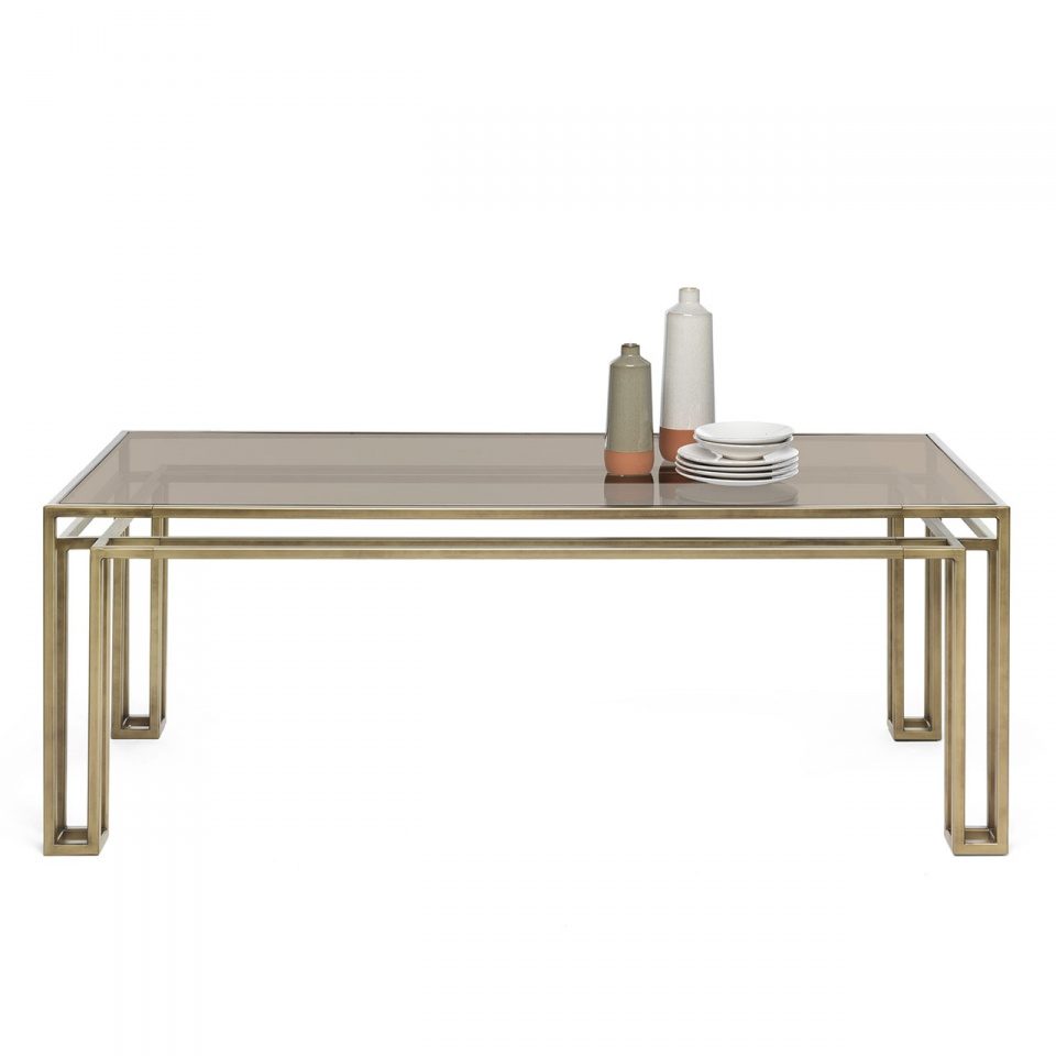Axis dining table with a nested brass frame