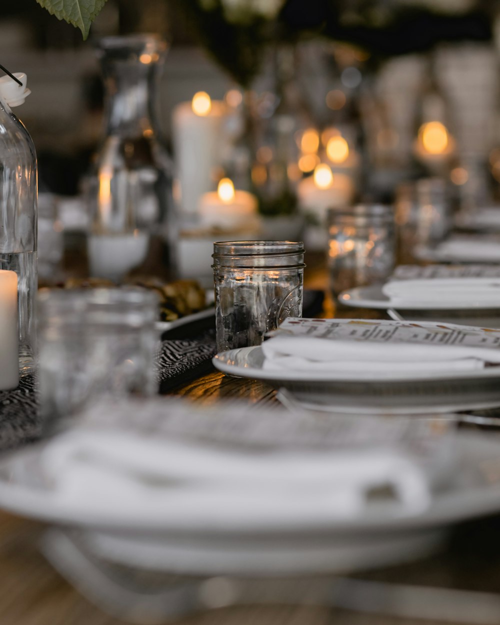 Rivet Dining Table — a long dining table laid for service
