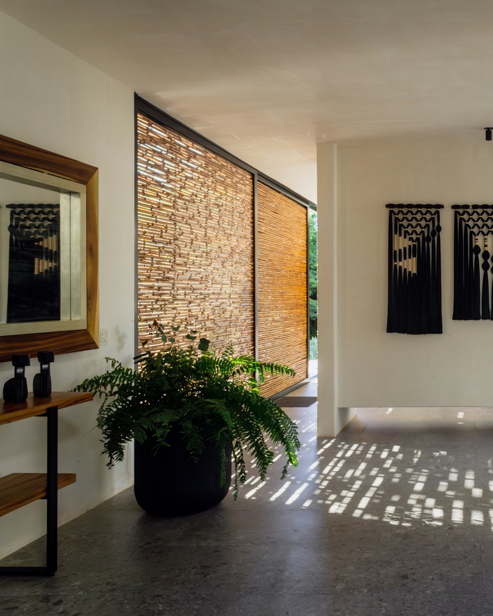 Shim Console — a hallway with wall hangings and plants