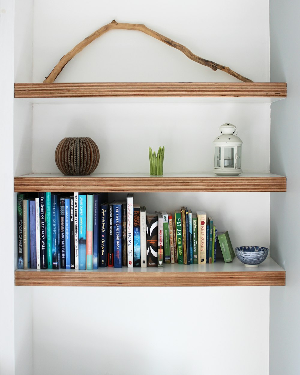 Stack Shelving Unit — a wall-fixed shelf with books