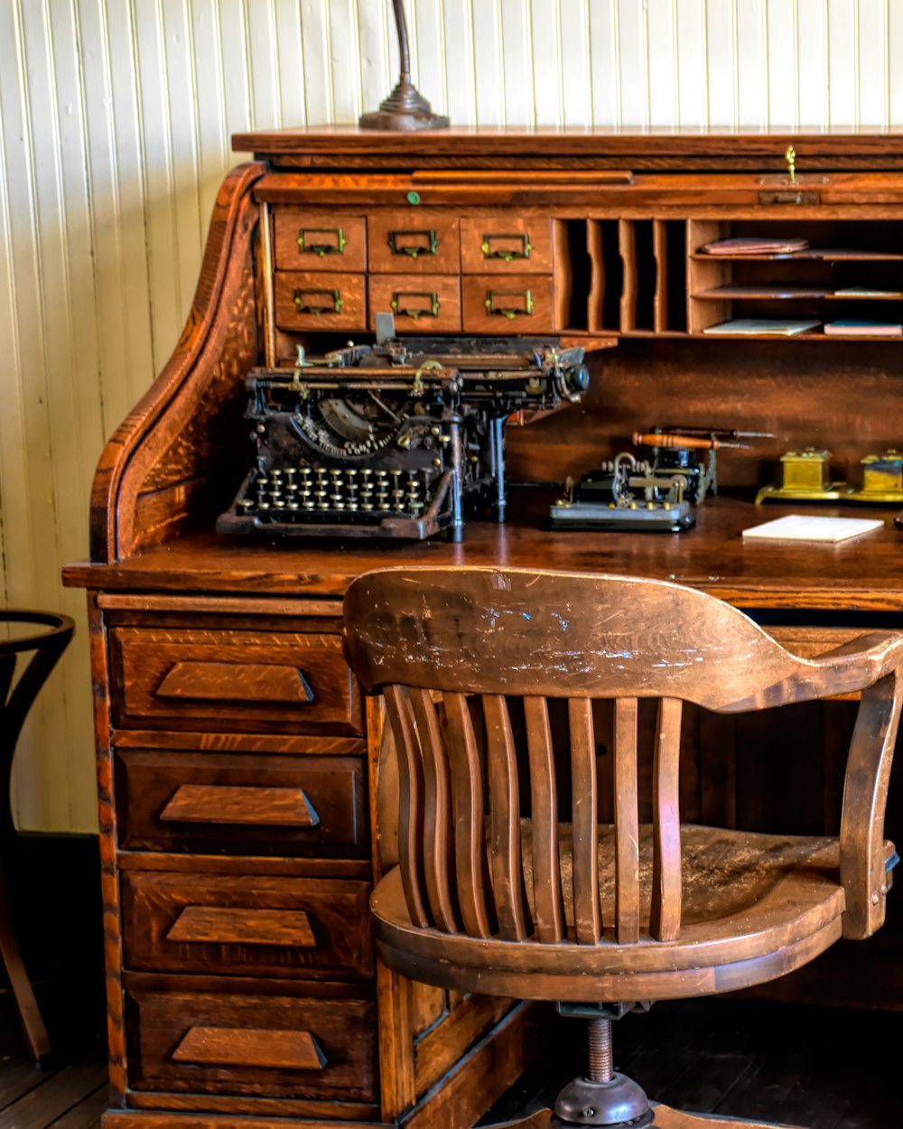 Tack Work Table — a desk with a chair beside it