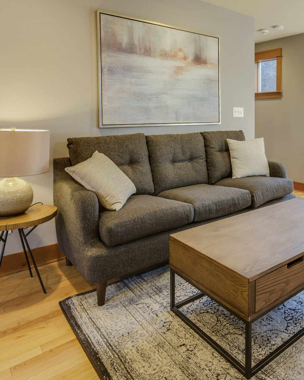 Wedge Coffee Table — a coffee table in front of a sofa